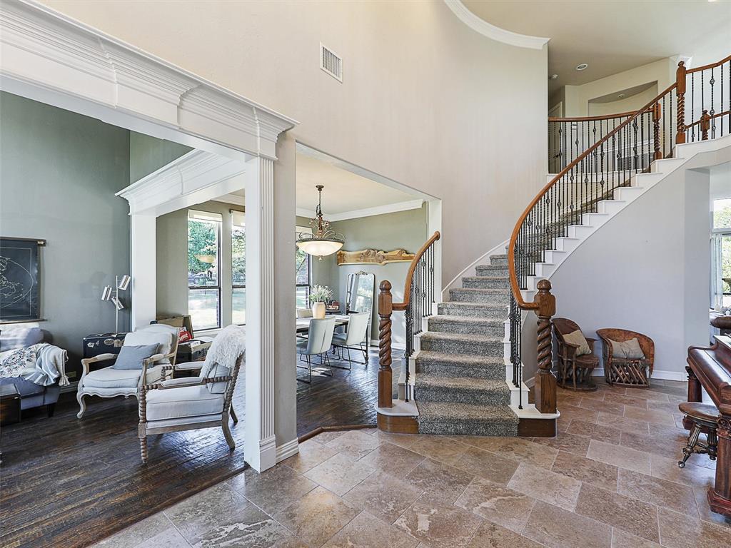 671 Countryside Drive Fairview, TX 75069 - Photo 3 of 32 a living room with furniture and stairs