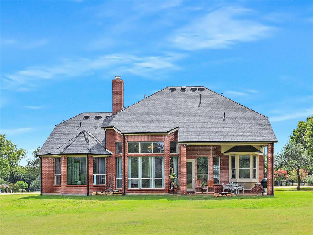 671 Countryside Drive Fairview, TX 75069 - Photo 32 of 32 front view of a house with a yard