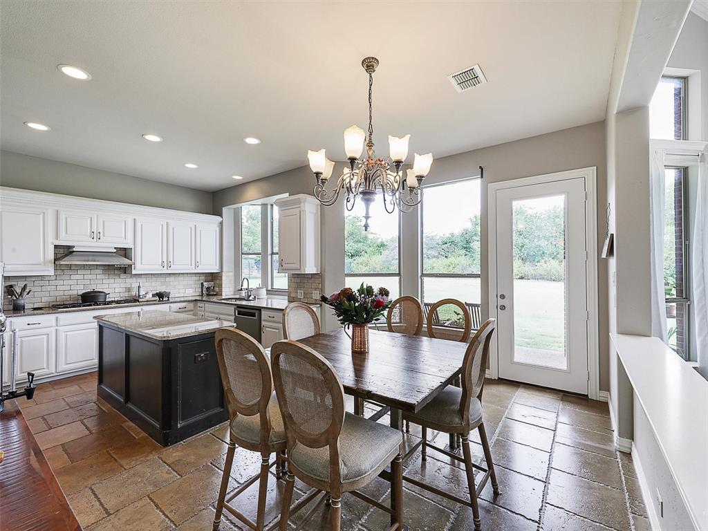 671 Countryside Drive Fairview, TX 75069 - Photo 10 of 32 a view of a dining room with furniture window and outside view