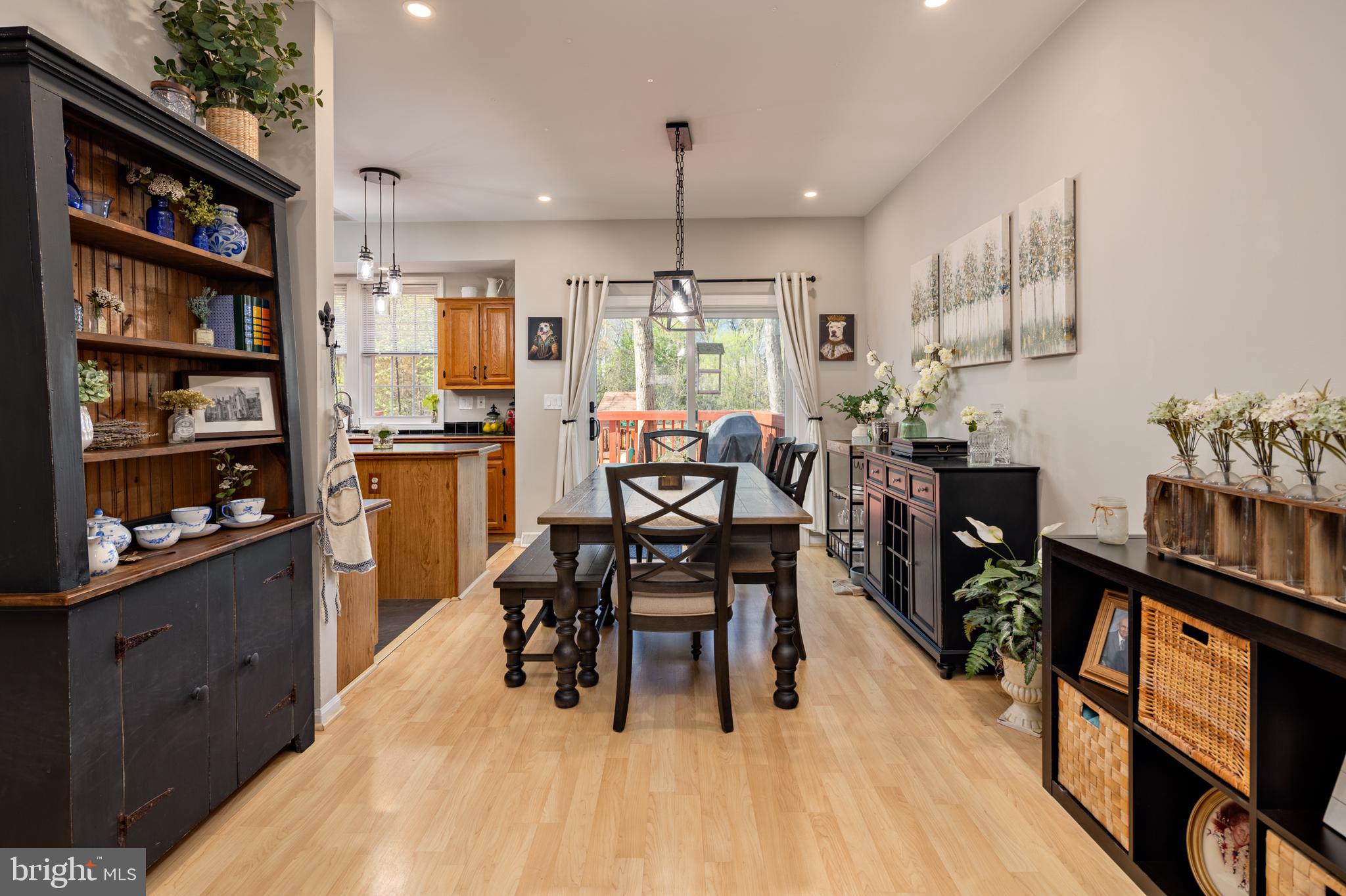 7213 Waterloo Pass Elkridge, MD 21075 - Photo 13 of 60 a view of a dining room with furniture window and wooden floor
