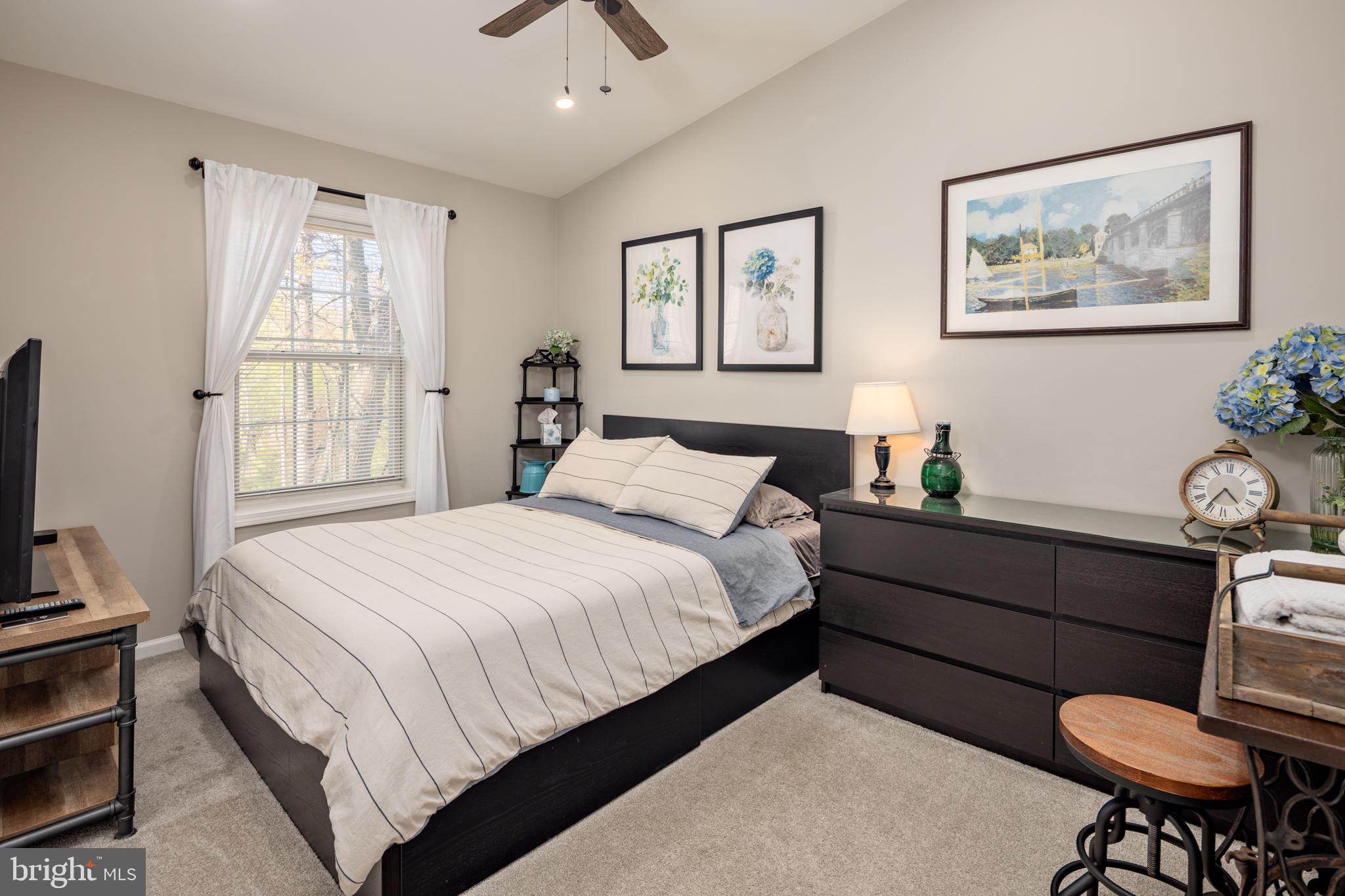7213 Waterloo Pass Elkridge, MD 21075 - Photo 23 of 60 a bed room with a bed window and a chair