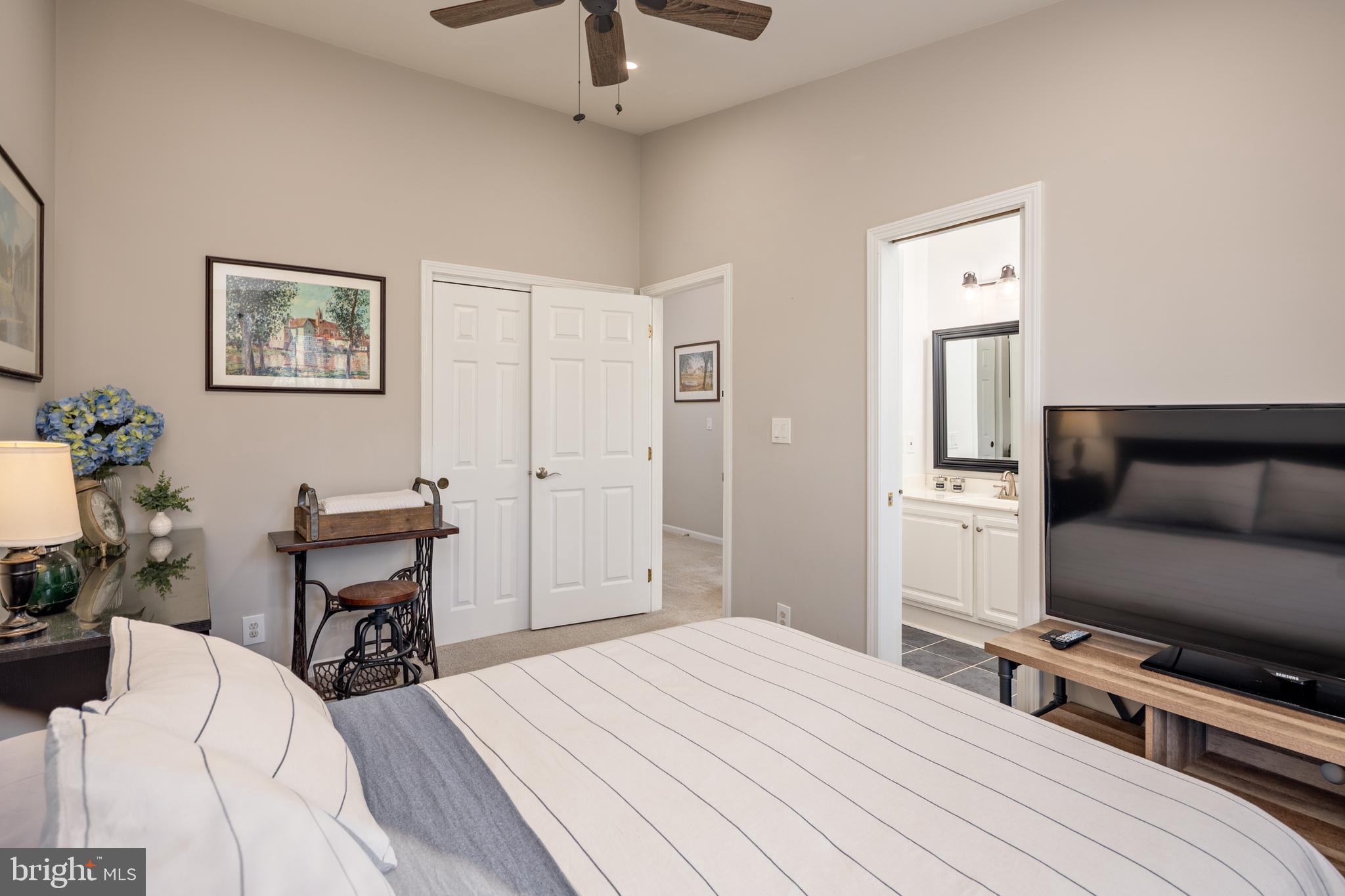 7213 Waterloo Pass Elkridge, MD 21075 - Photo 24 of 60 a bedroom with a bed and a flat screen tv