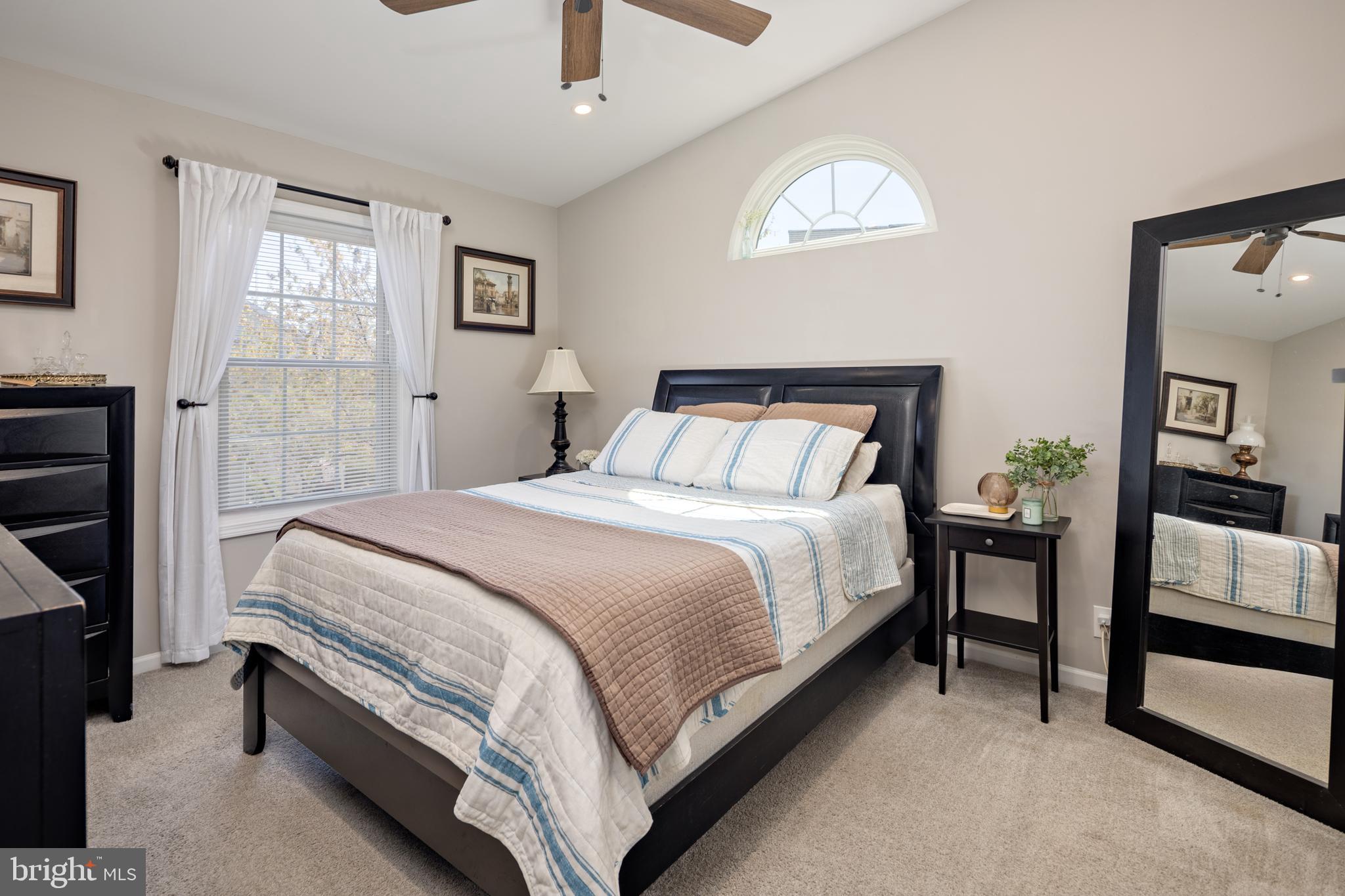 7213 Waterloo Pass Elkridge, MD 21075 - Photo 28 of 60 a bedroom with a bed and a night stand
