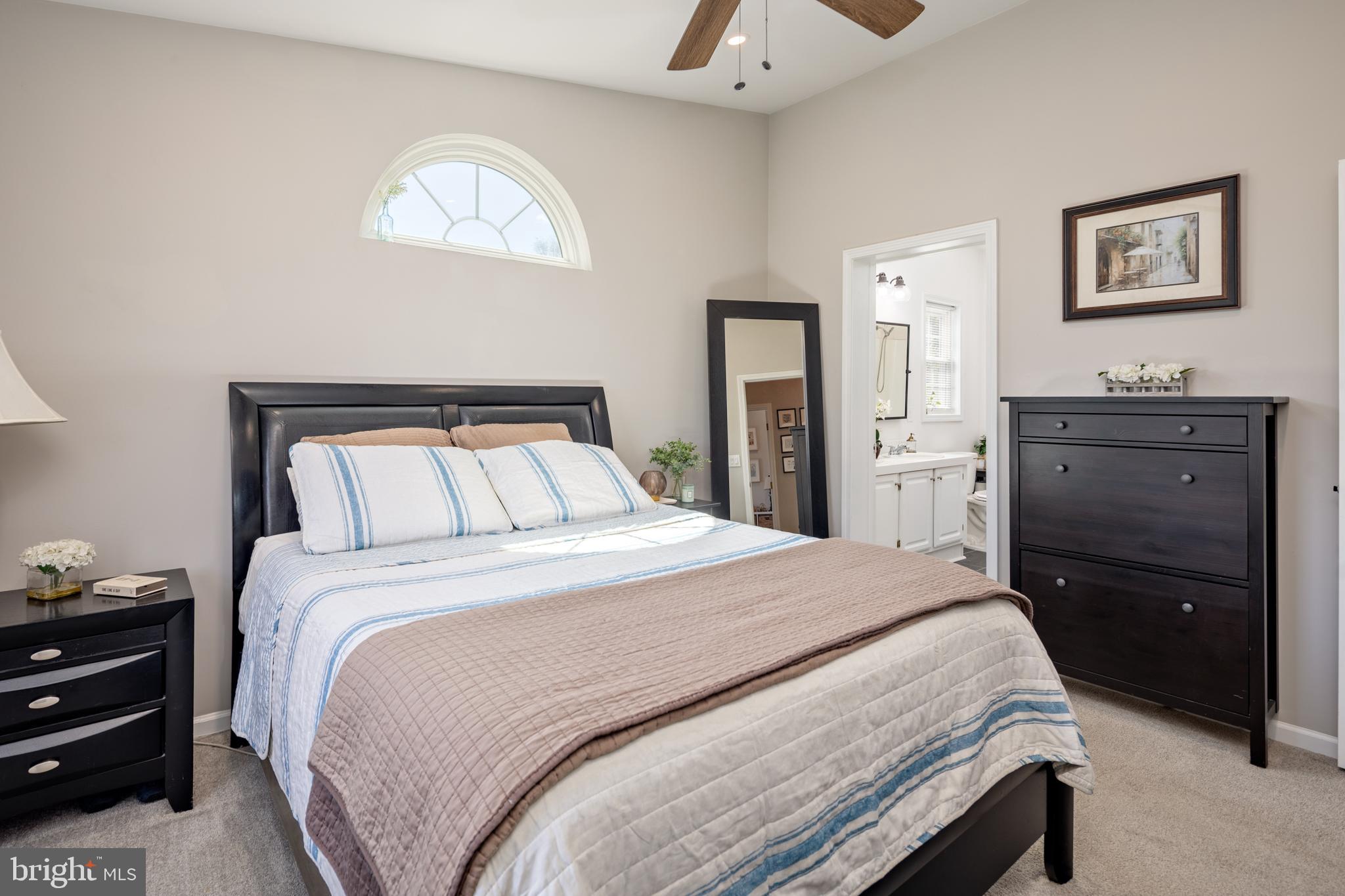 7213 Waterloo Pass Elkridge, MD 21075 - Photo 29 of 60 a bedroom with a bed and a dresser