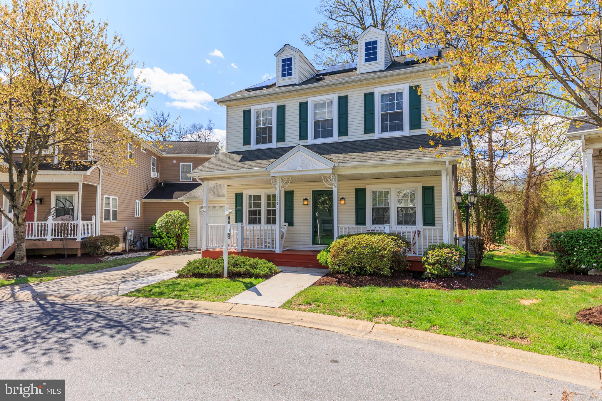 7213 Waterloo Pass Elkridge, MD 21075 - Photo 47 of 60 a front view of a house with a garden and plants