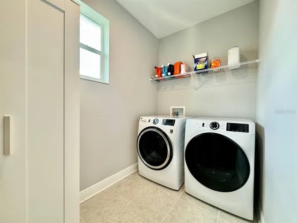 a utility room with dryer and washer