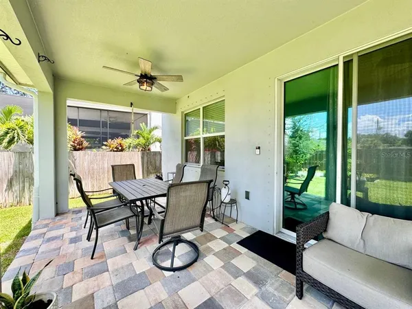 a view of a dining room with furniture wooden floor and a chandelier