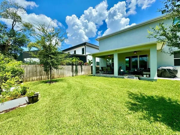 a view of a house with a yard porch and sitting area