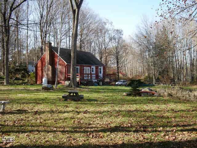 20 Ridgebury Road Ridgefield, CT 06877 - Photo 1 of 1 a view of a house with a yard and sitting area