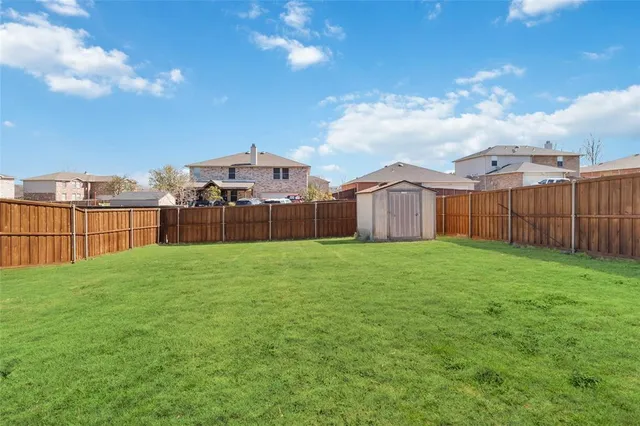 a view of a backyard with a garden