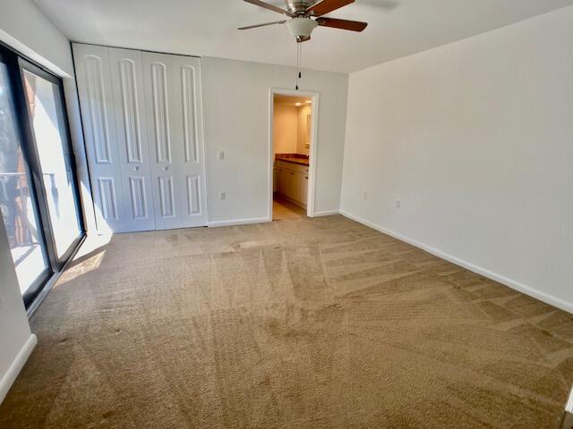 3900 County Line Road, Unit 2D Tequesta, FL 33469 - Photo 13 of 19 a view of an empty room with a window