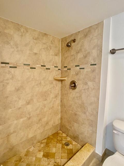 3900 County Line Road, Unit 2D Tequesta, FL 33469 - Photo 15 of 19 a bathroom with a shower and a toilet