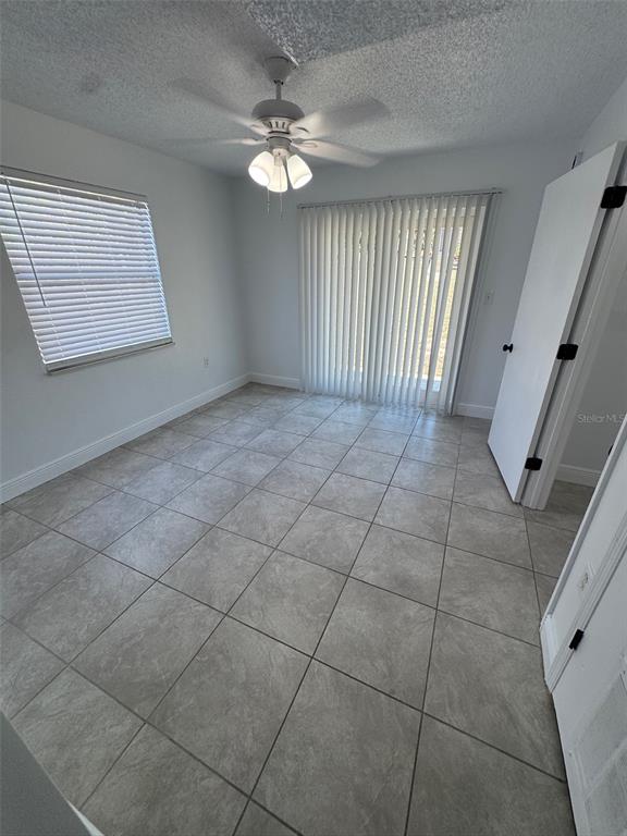 1195 Bentley Road, Unit 1 Leesburg, FL 34748 - Photo 12 of 13 a view of an empty room with a window
