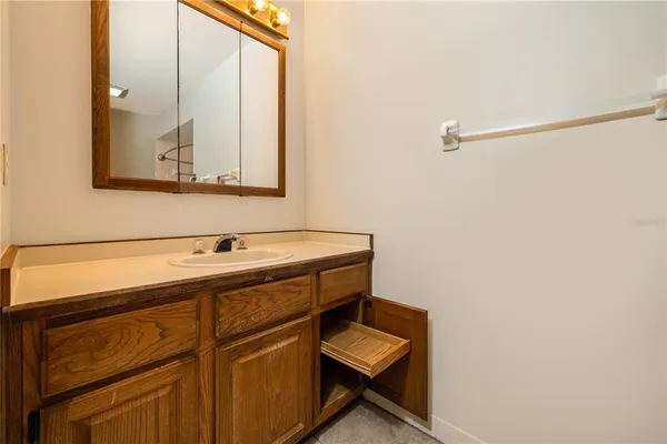 a bathroom with a sink and a mirror