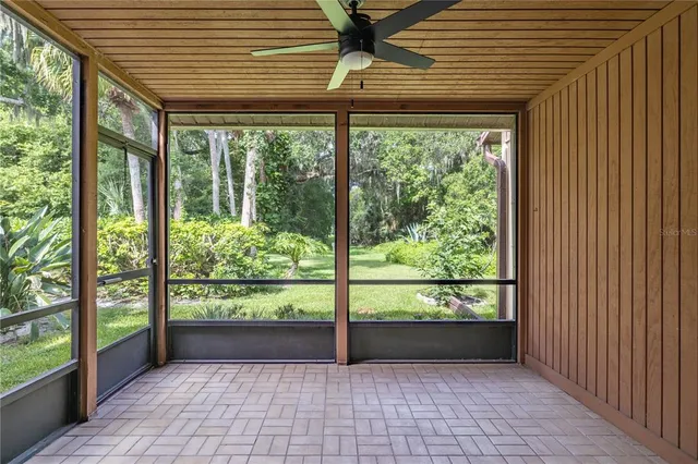 a view of a porch with wooden floor