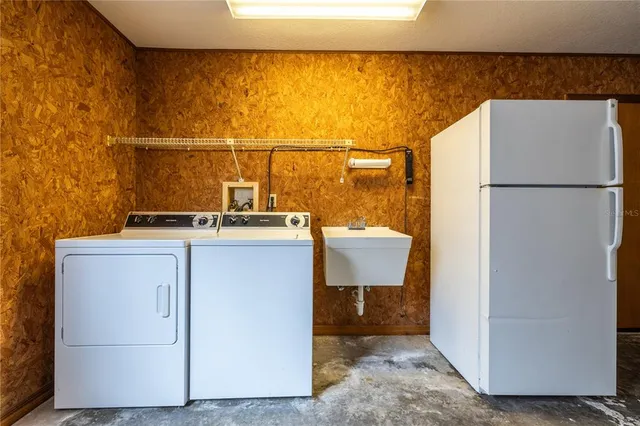 a utility room with washer and dryer