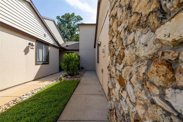a path view of a house with a yard