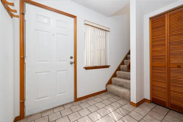 an entryway with a white walls