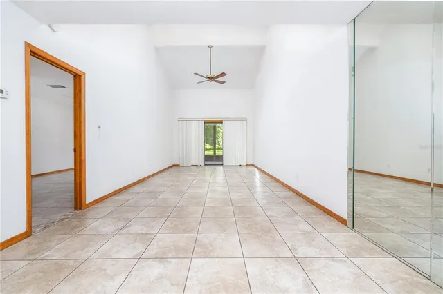 wooden floor in a hall with a window
