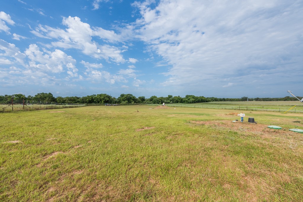 859 Ivy Switch Road Luling, TX 78648 - Photo 2 of 29 View of grassy yard featuring a view of countryside