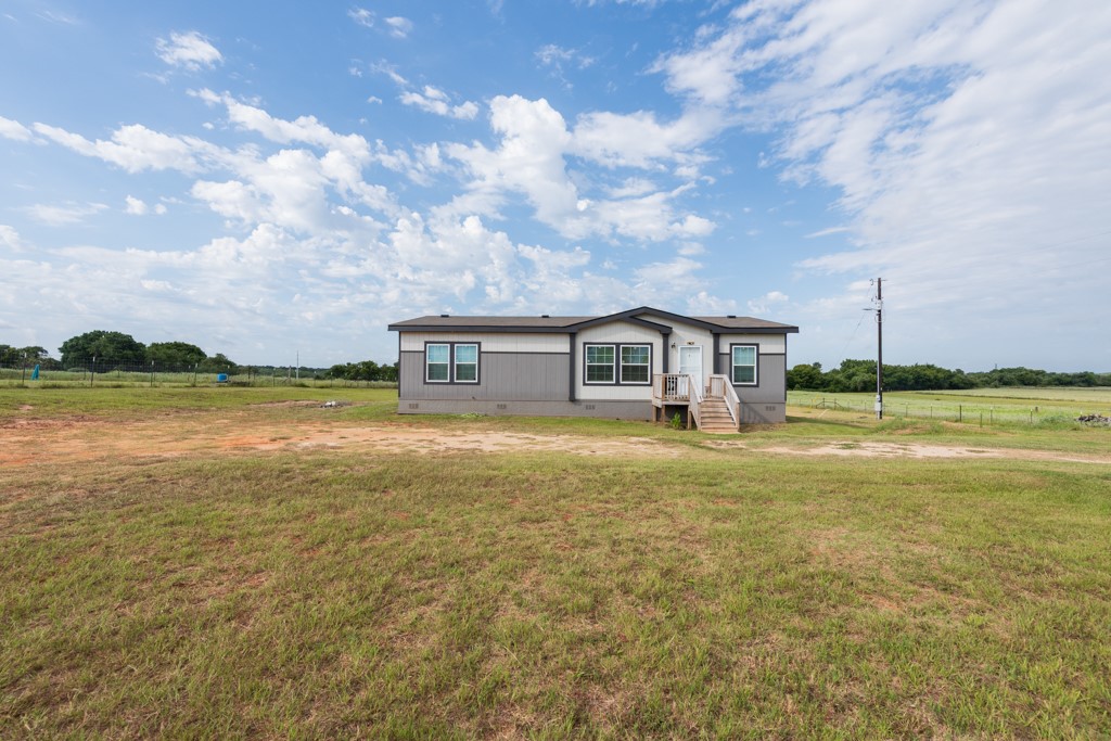859 Ivy Switch Road Luling, TX 78648 - Photo 5 of 29 Manufactured / mobile home with crawl space, a front lawn, and a view of countryside
