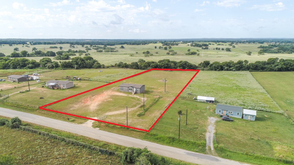 859 Ivy Switch Road Luling, TX 78648 - Photo 6 of 29 Aerial view of sparsely populated area featuring property boundaries highlighted