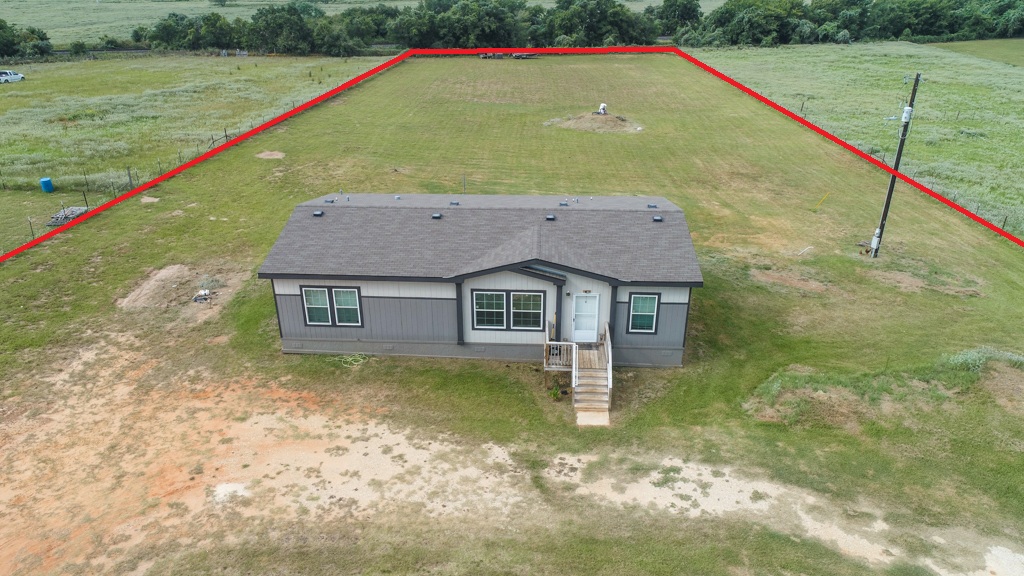 859 Ivy Switch Road Luling, TX 78648 - Photo 8 of 29 Aerial view of sparsely populated area with property parcel outlined