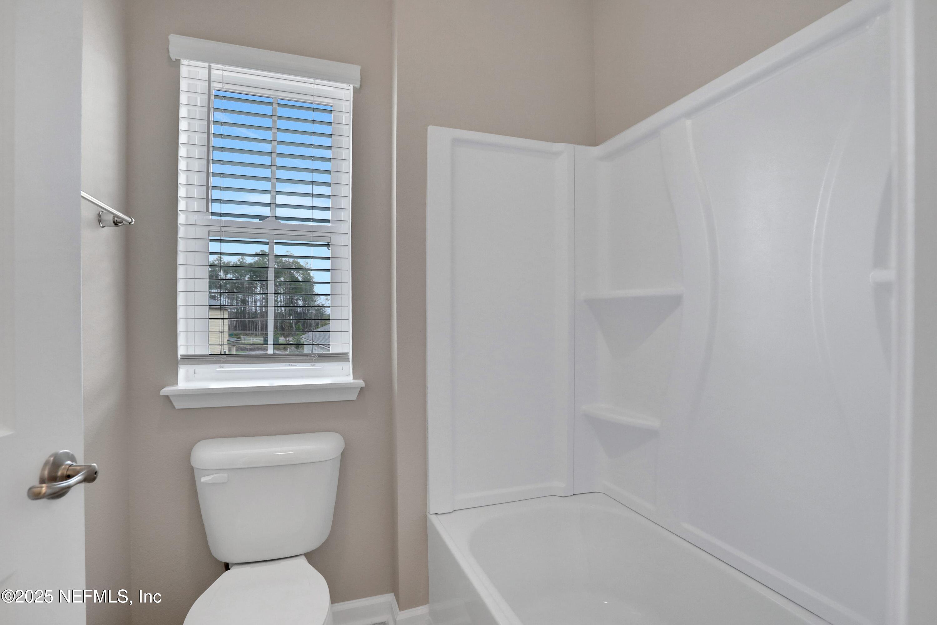 494 Archstone Way St. Augustine, FL 32092 - Photo 64 of 67 a bathroom with a toilet a sink and a bathtub