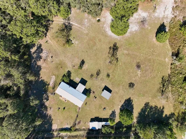 a view of a yard with an outdoor space