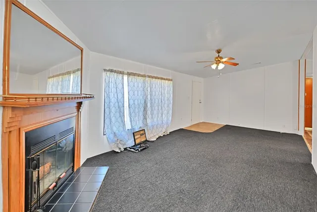 a view of a livingroom with furniture and a fireplace