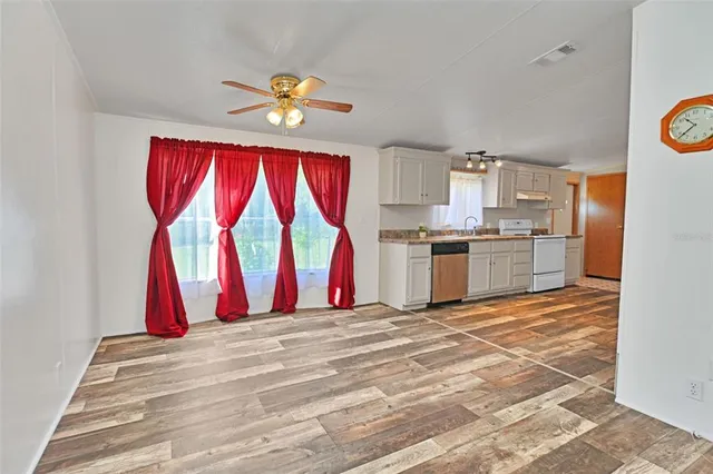 a view of kitchen with wooden floor and window