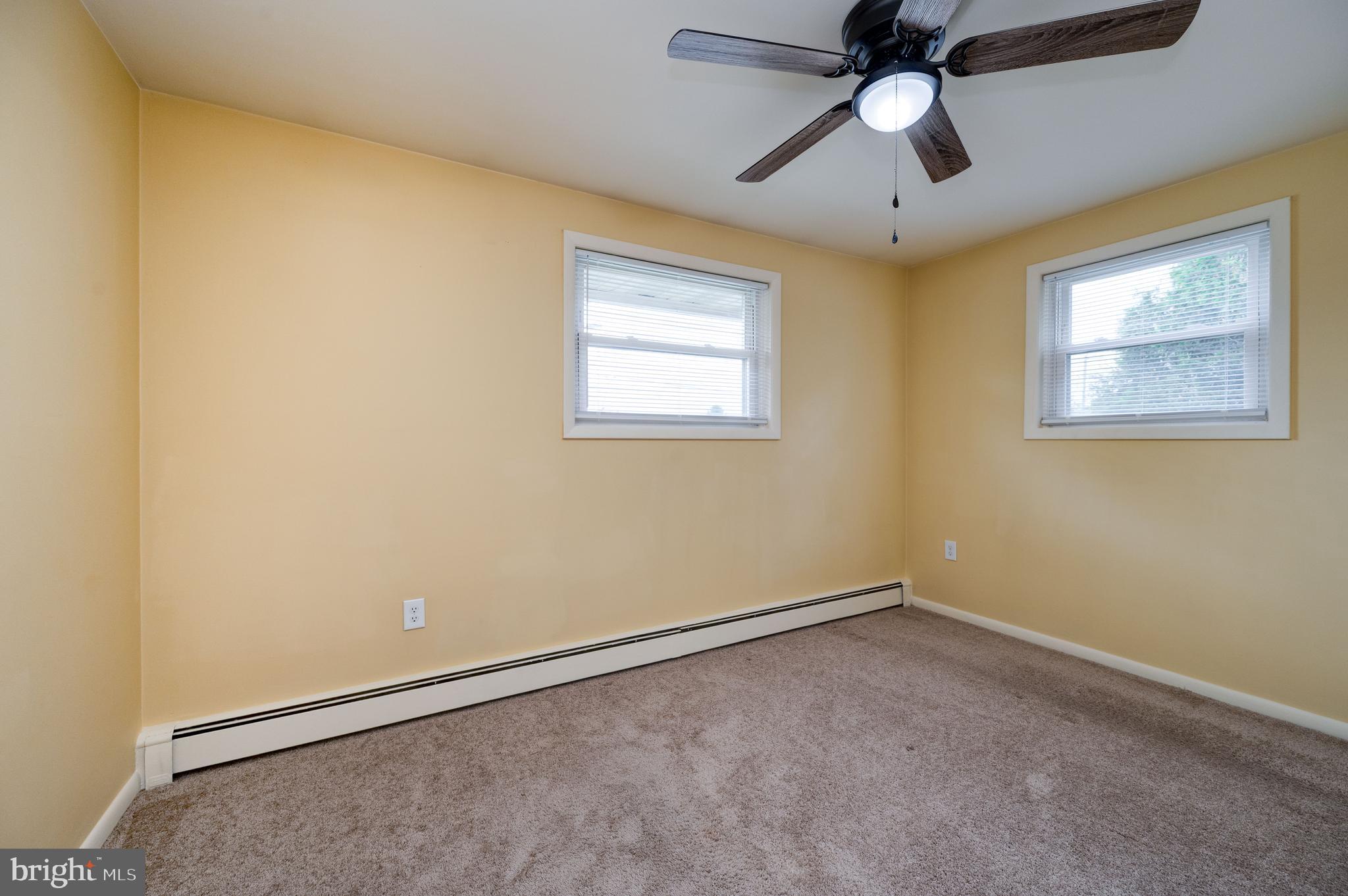 1392 New Holland Road Reading, PA 19607 - Photo 17 of 27 an empty room with a window and a fan