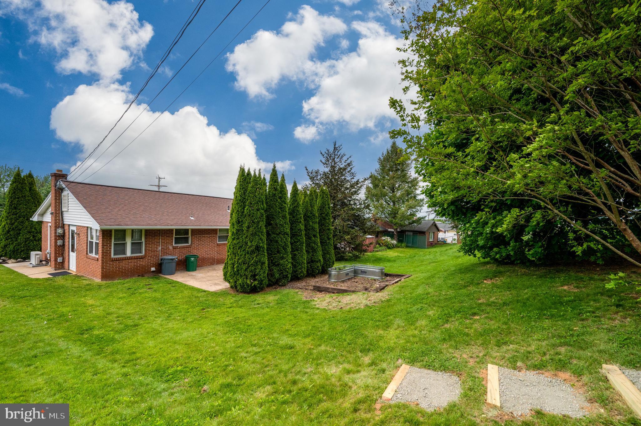 1392 New Holland Road Reading, PA 19607 - Photo 21 of 27 a view of a house with a big yard and large trees