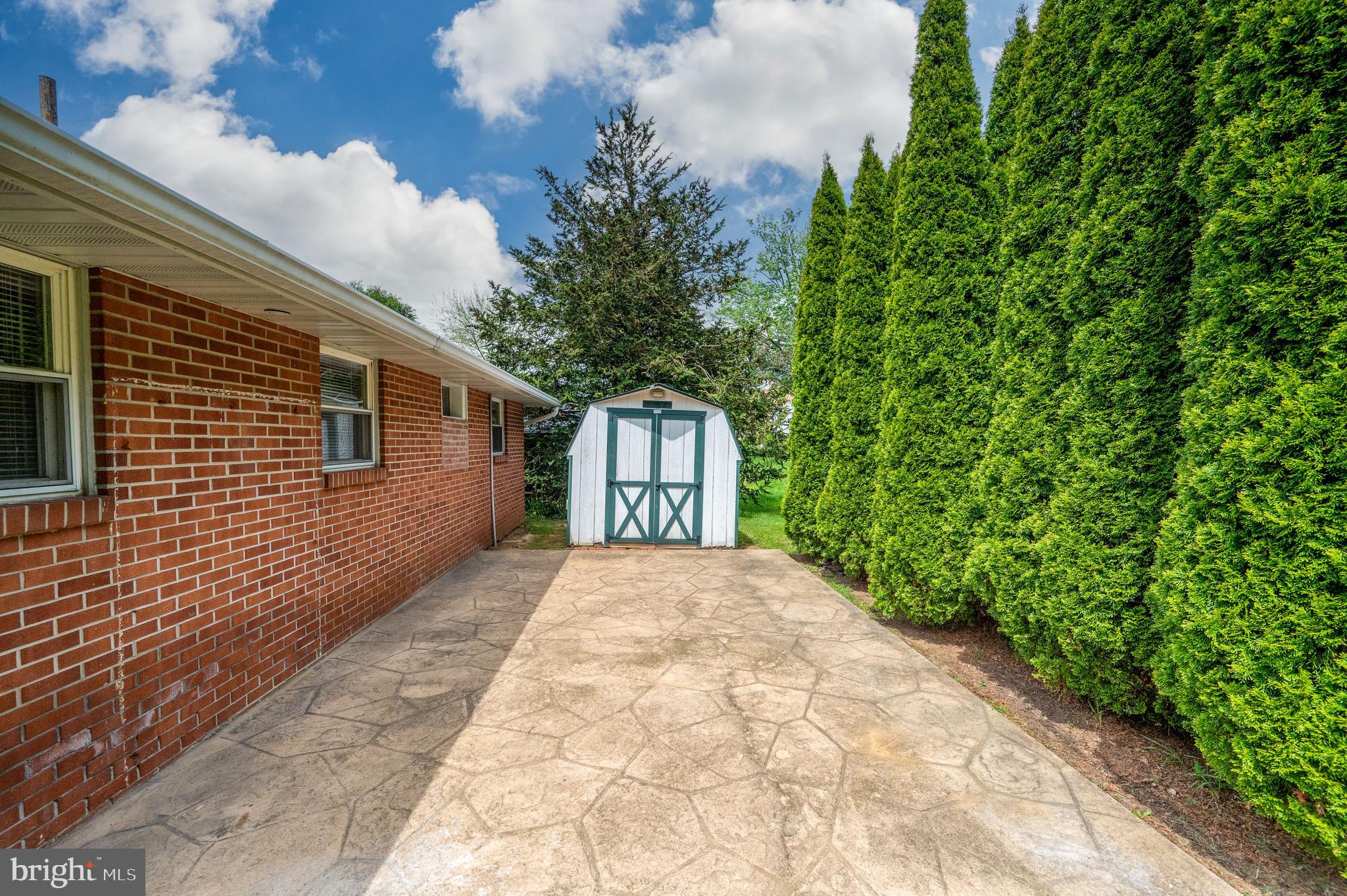 1392 New Holland Road Reading, PA 19607 - Photo 24 of 27 a front view of a house with a garden