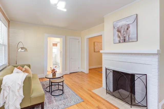a view of a dining room with furniture and a chandelier