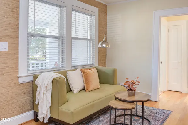 a kitchen with stainless steel appliances granite countertop a sink a stove cabinets and a dining table