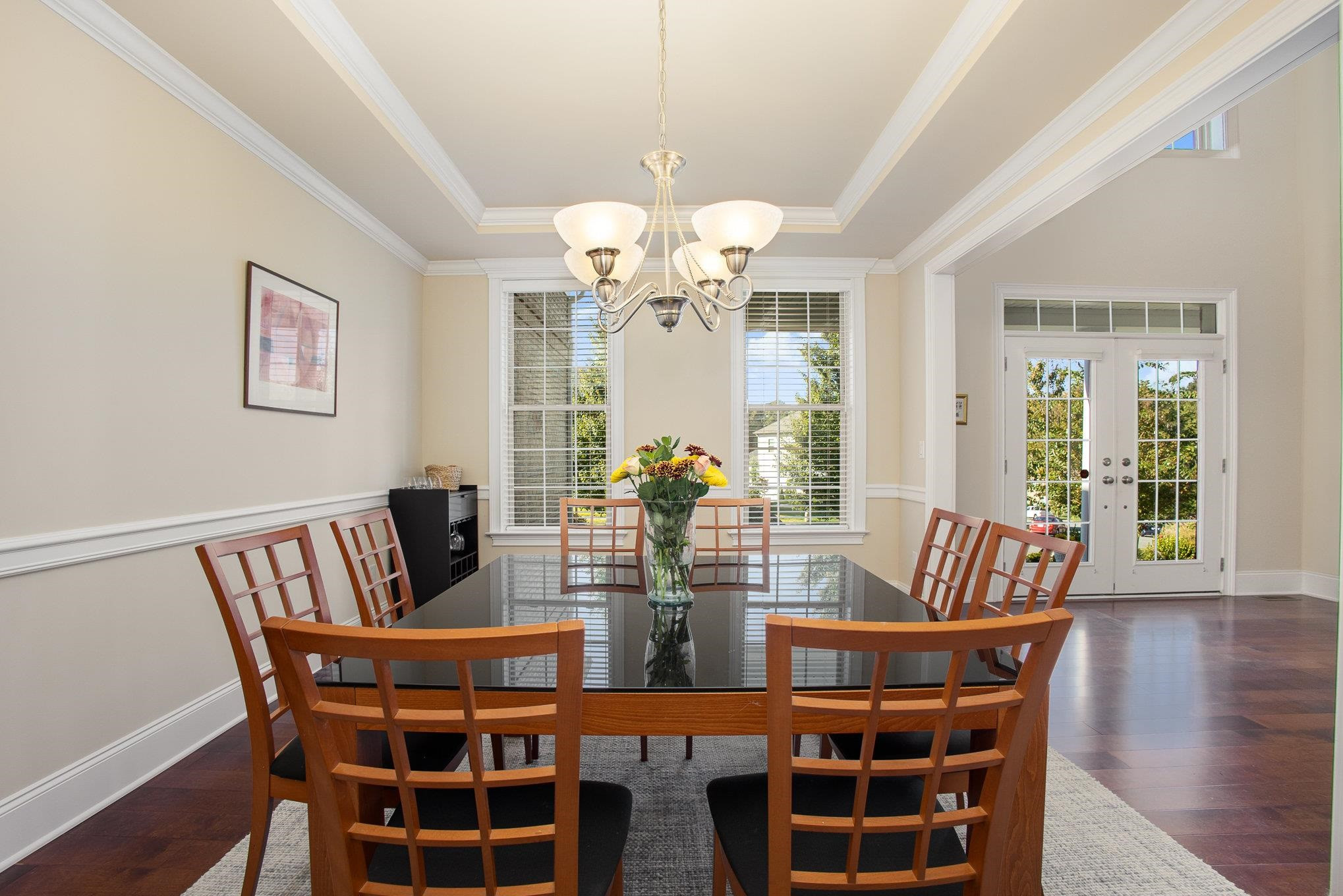 610 Swift Creek Crossing Durham, NC 27713 - Photo 11 of 48 a view of a dining room with furniture wooden floor and chandelier