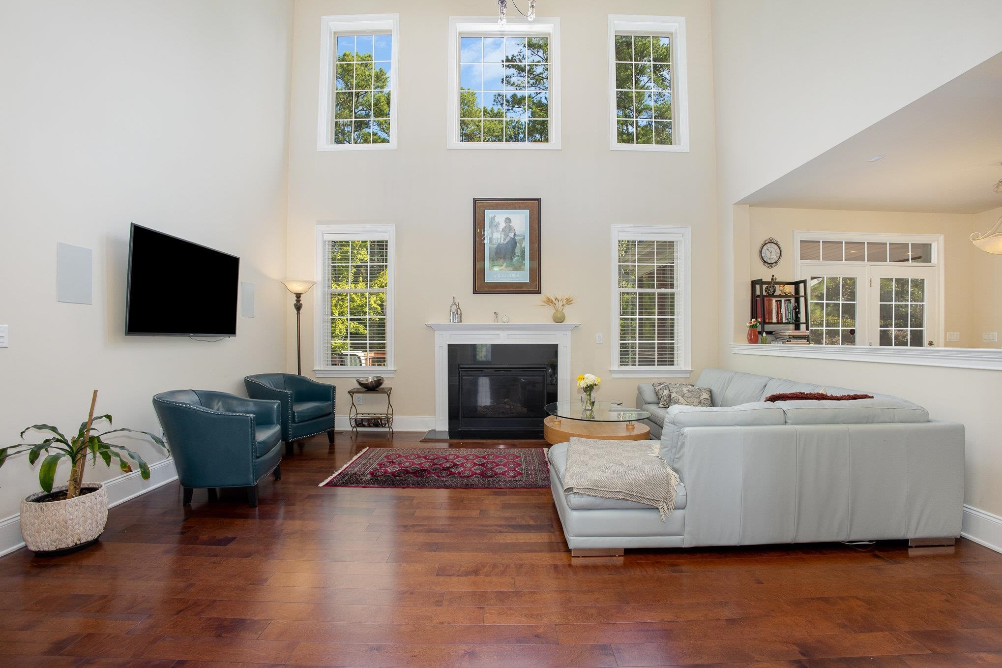 610 Swift Creek Crossing Durham, NC 27713 - Photo 14 of 48 a living room with furniture a flat screen tv and a fireplace