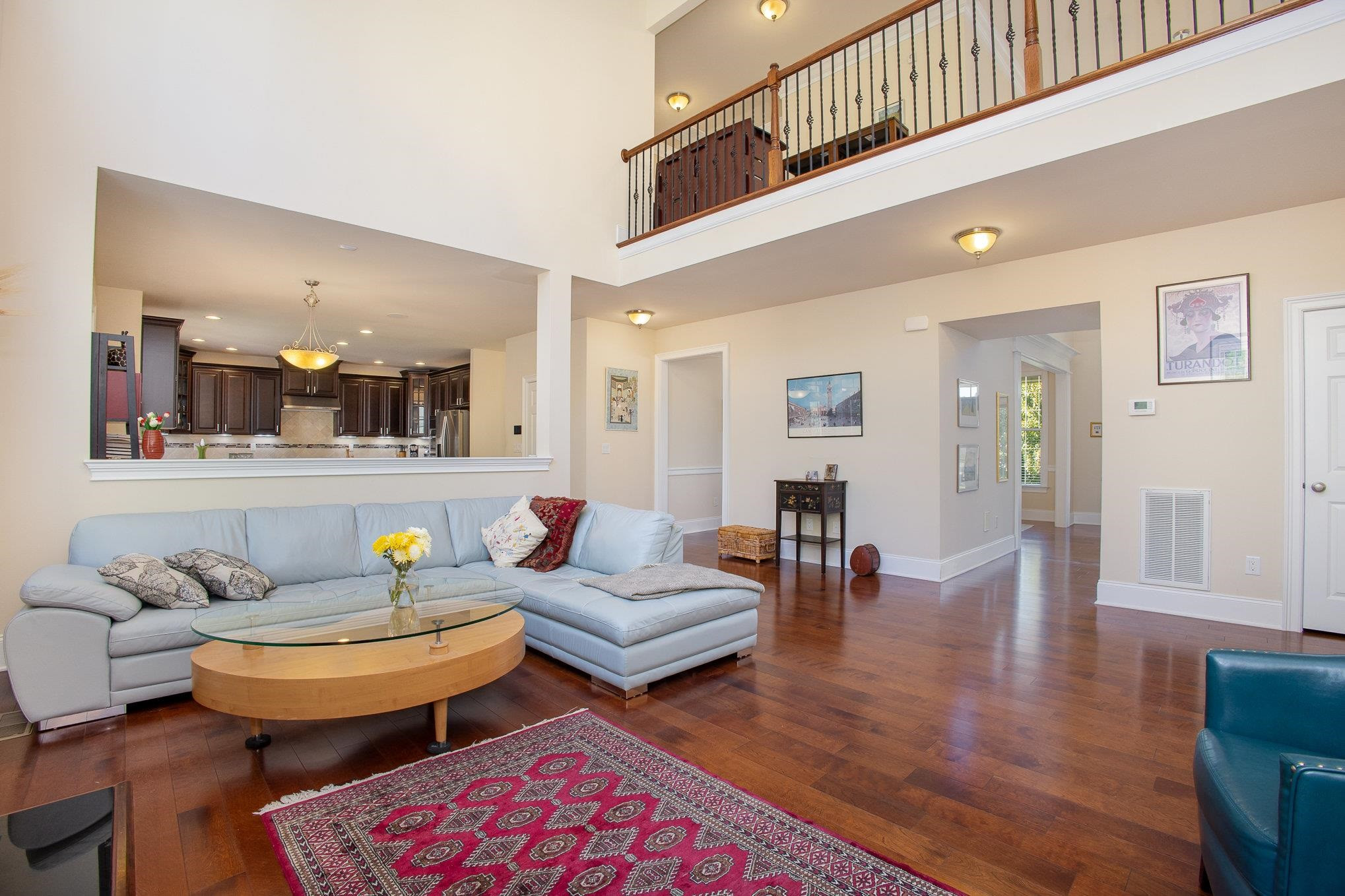 610 Swift Creek Crossing Durham, NC 27713 - Photo 16 of 48 a living room with furniture and wooden floor
