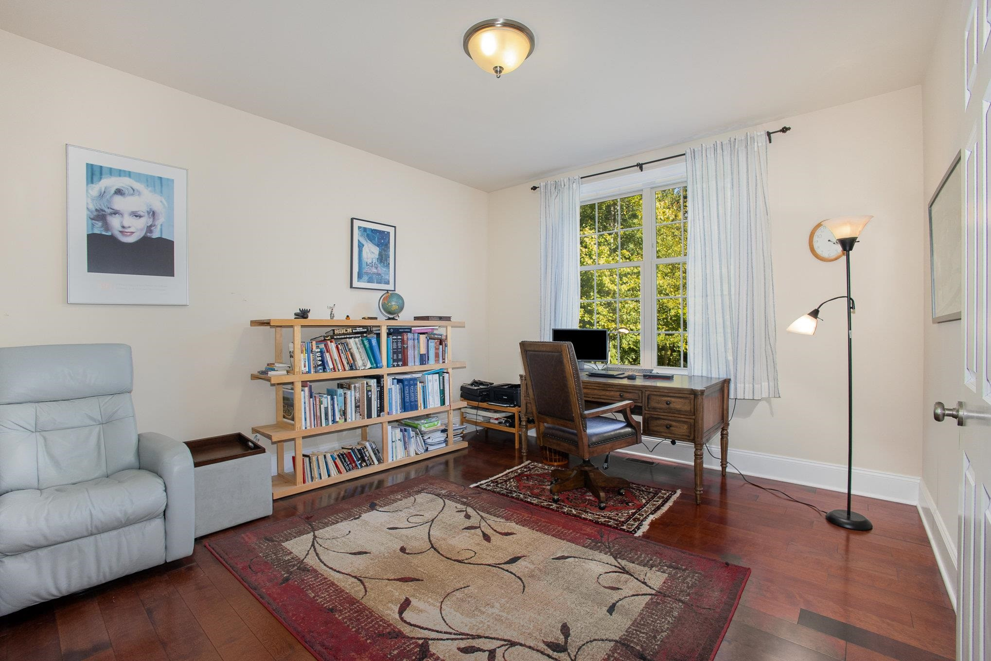 610 Swift Creek Crossing Durham, NC 27713 - Photo 17 of 48 a living room with furniture and a book shelf