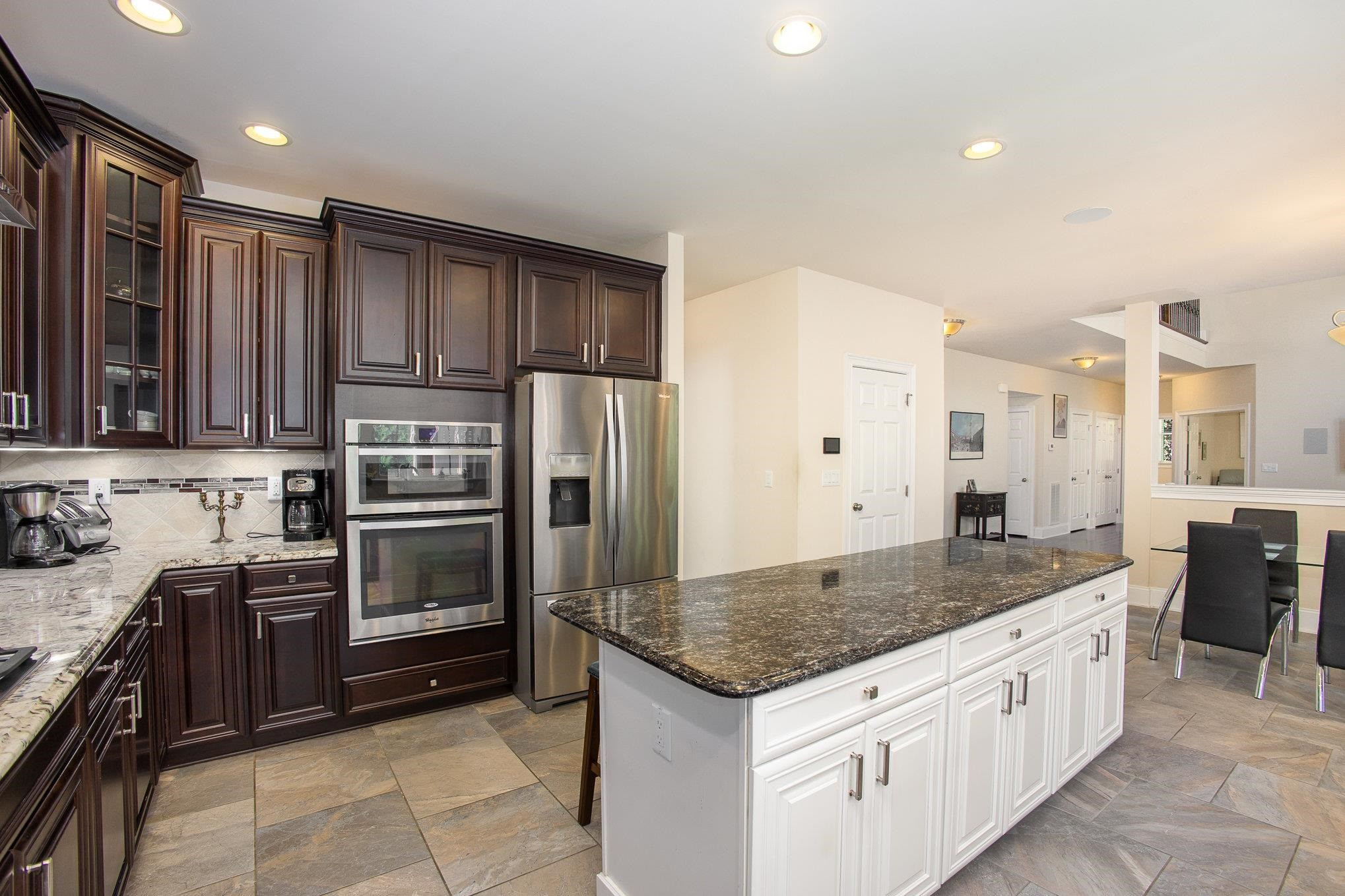 610 Swift Creek Crossing Durham, NC 27713 - Photo 21 of 48 a kitchen with stainless steel appliances granite countertop a sink stove and refrigerator