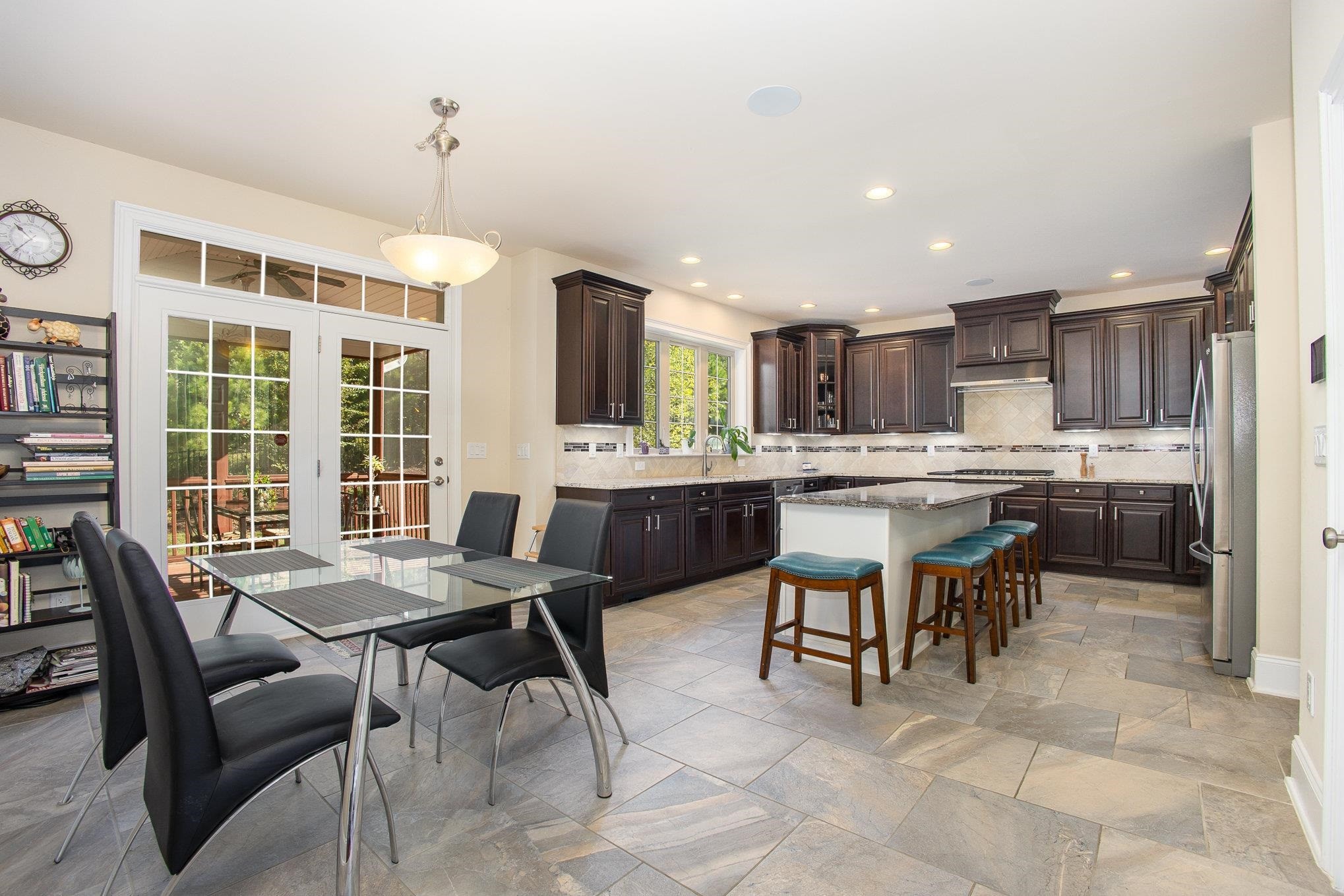 610 Swift Creek Crossing Durham, NC 27713 - Photo 24 of 48 a kitchen with a table and chairs in it