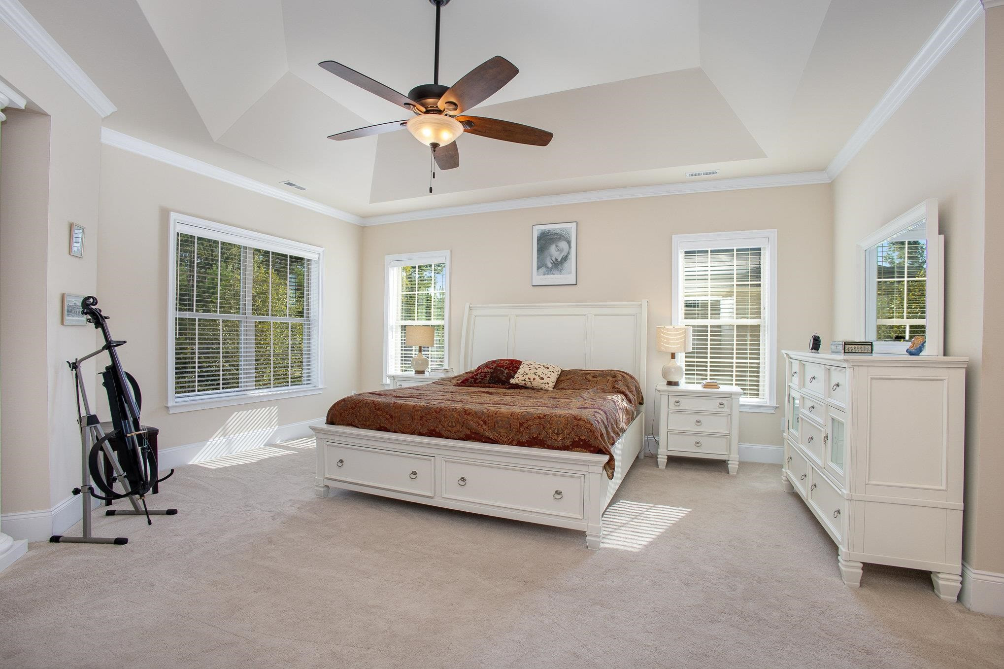 610 Swift Creek Crossing Durham, NC 27713 - Photo 26 of 48 a bedroom with a bed and a chandelier
