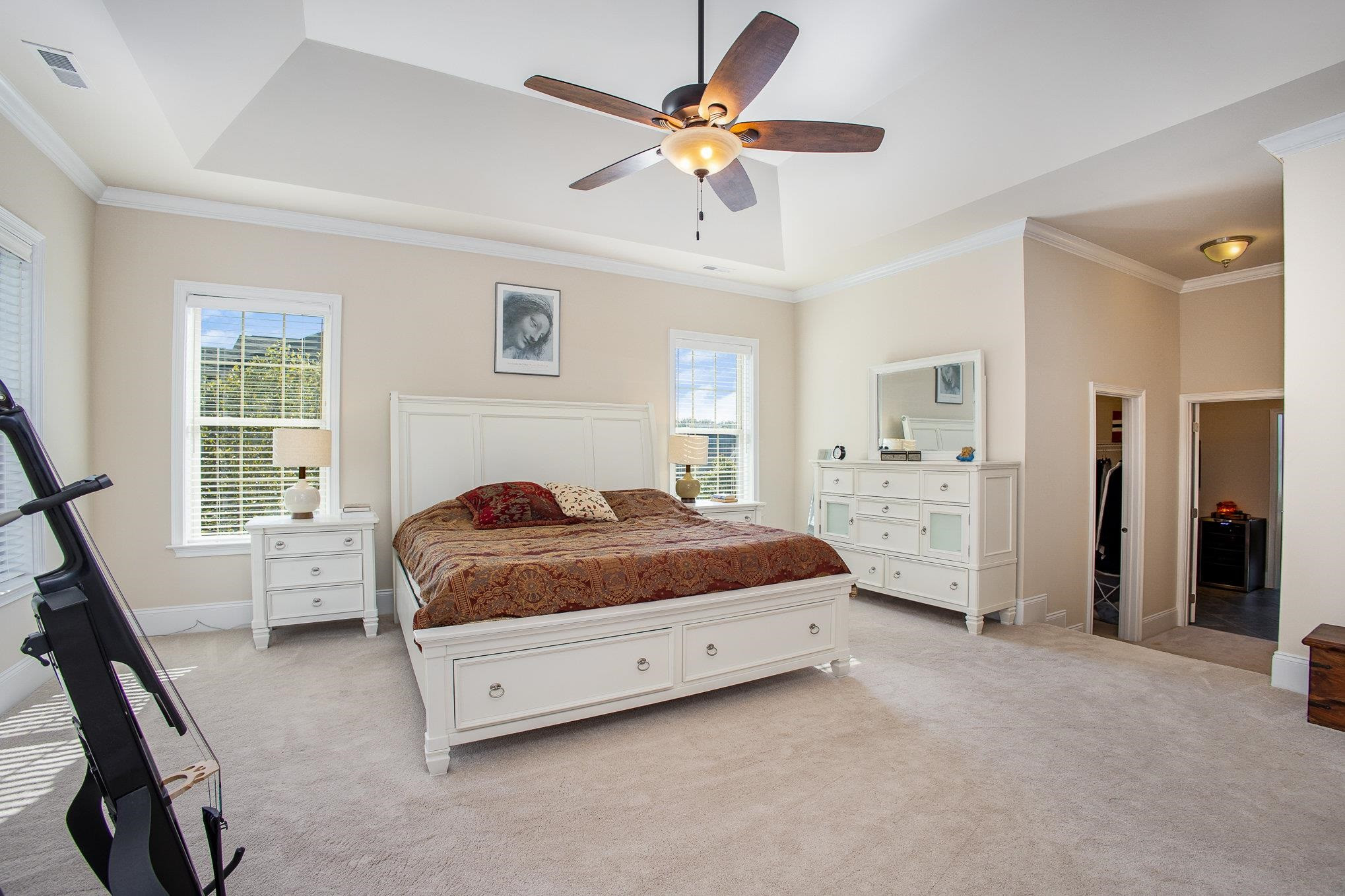 610 Swift Creek Crossing Durham, NC 27713 - Photo 27 of 48 a spacious bedroom with a bed and a chandelier