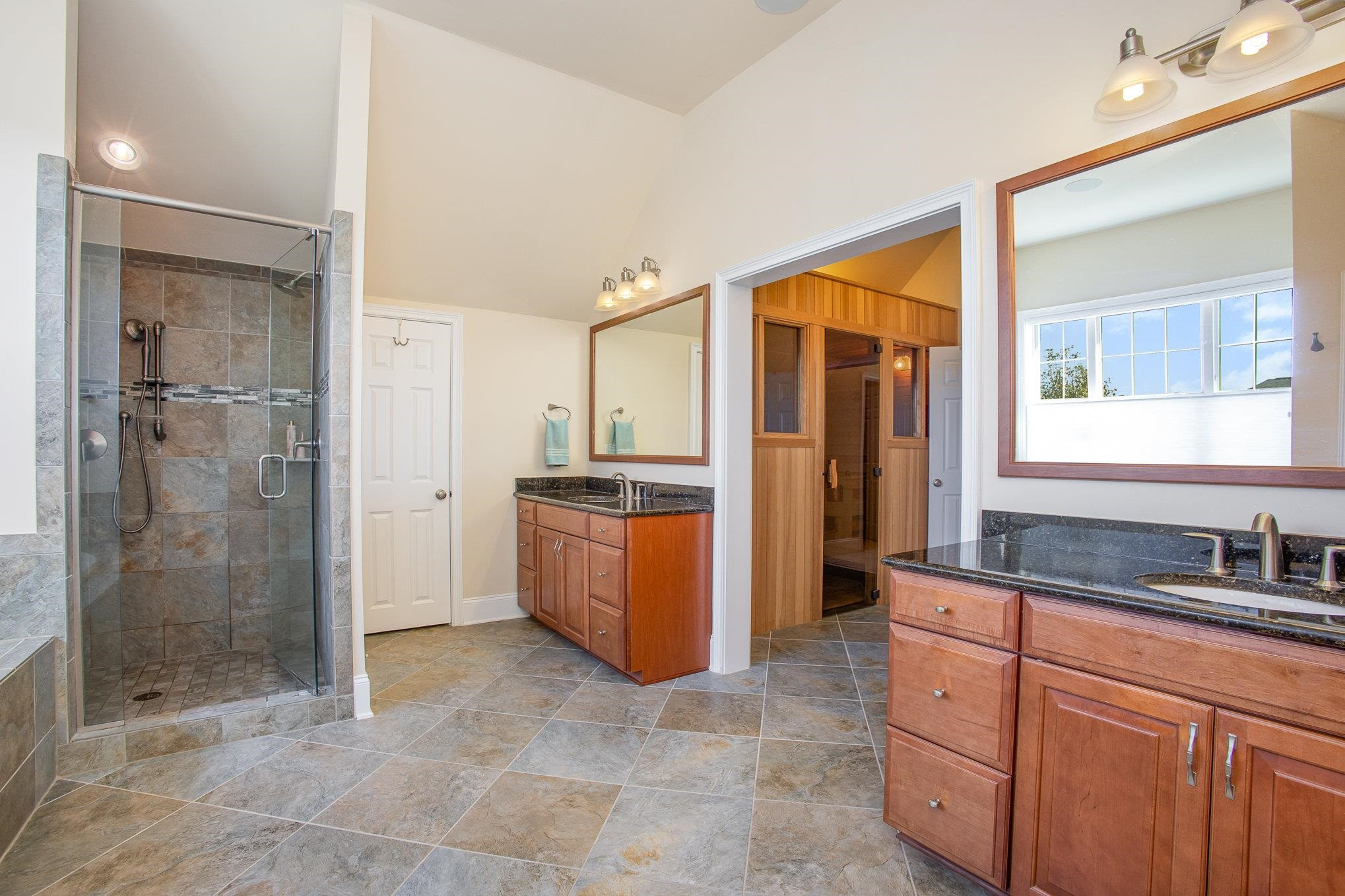 610 Swift Creek Crossing Durham, NC 27713 - Photo 32 of 48 a bathroom with a tub sink shower and mirror