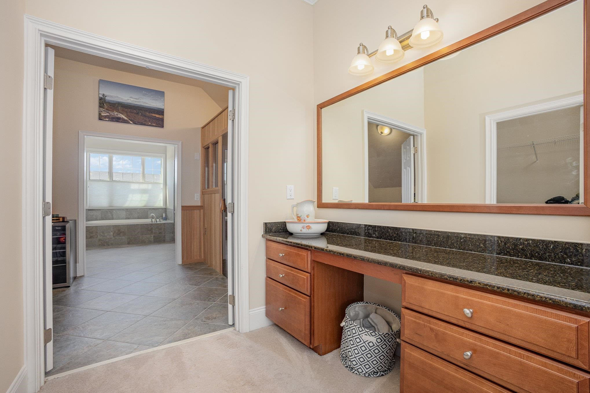 610 Swift Creek Crossing Durham, NC 27713 - Photo 33 of 48 a spacious bathroom with a granite countertop sink and a mirror