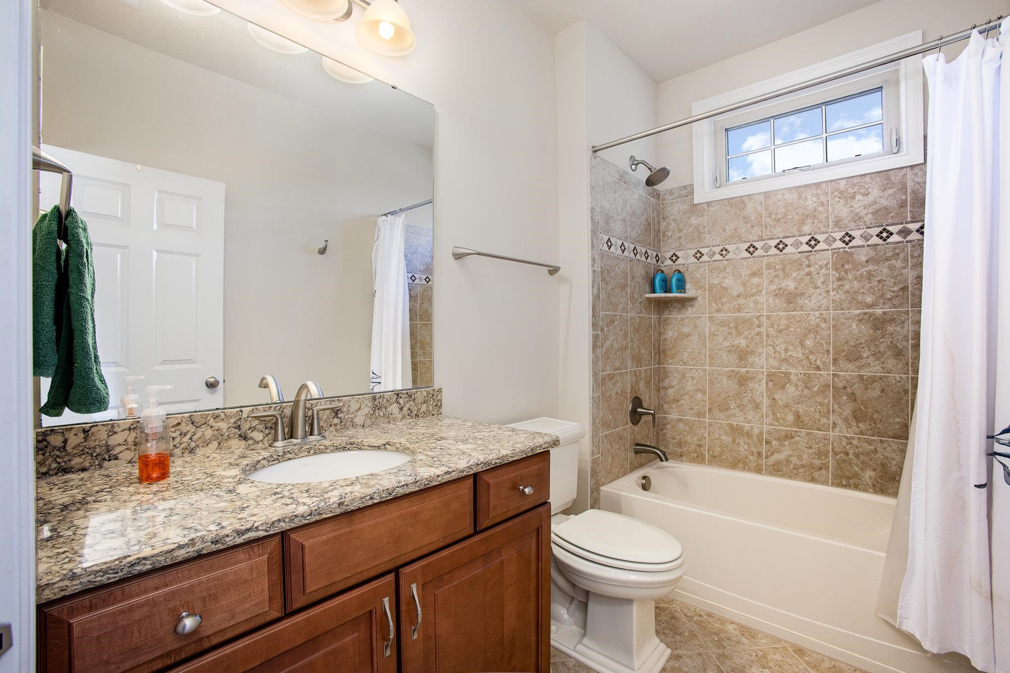 610 Swift Creek Crossing Durham, NC 27713 - Photo 36 of 48 a bathroom with a granite countertop toilet sink and mirror