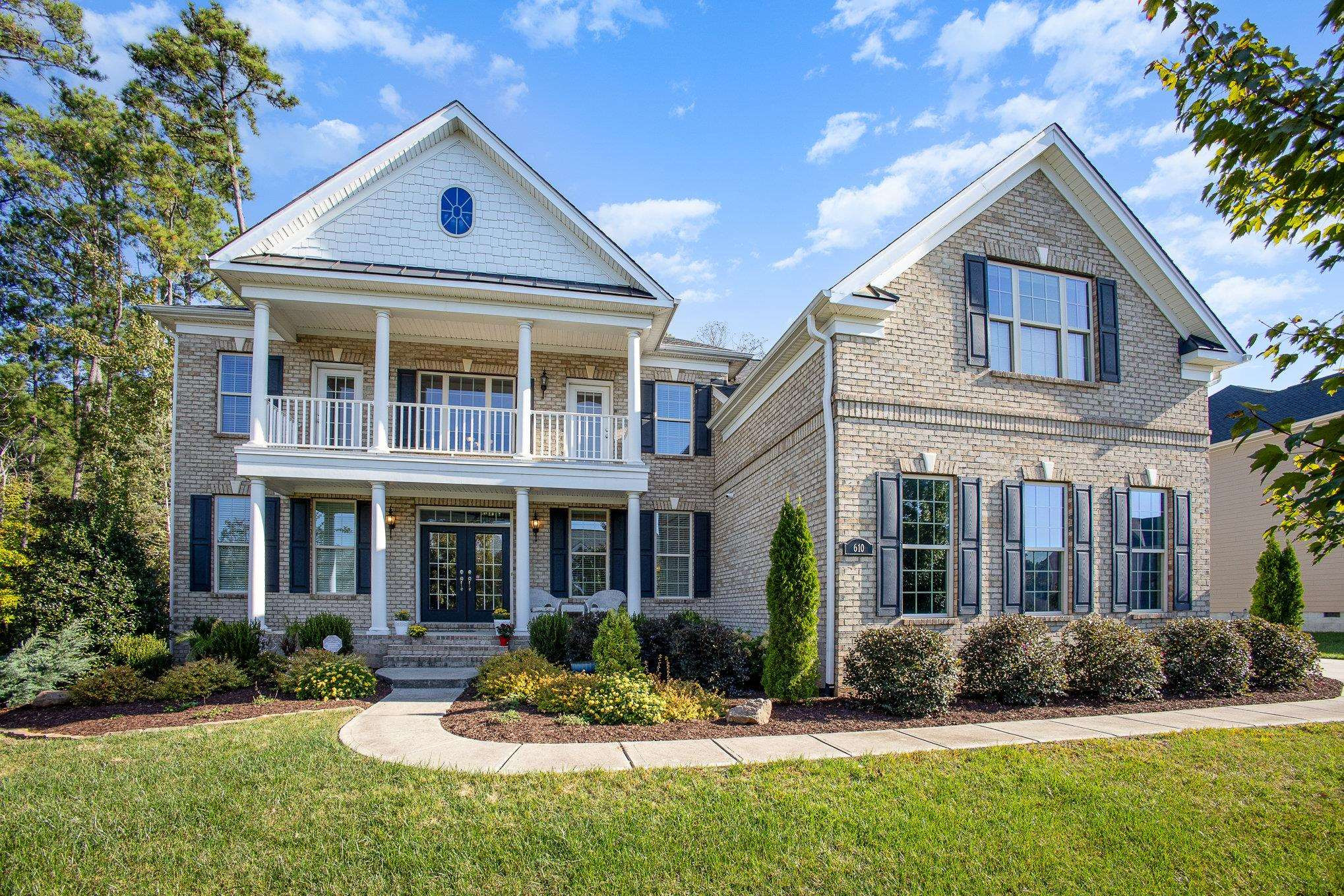 610 Swift Creek Crossing Durham, NC 27713 - Photo 4 of 48 a front view of a house with a yard