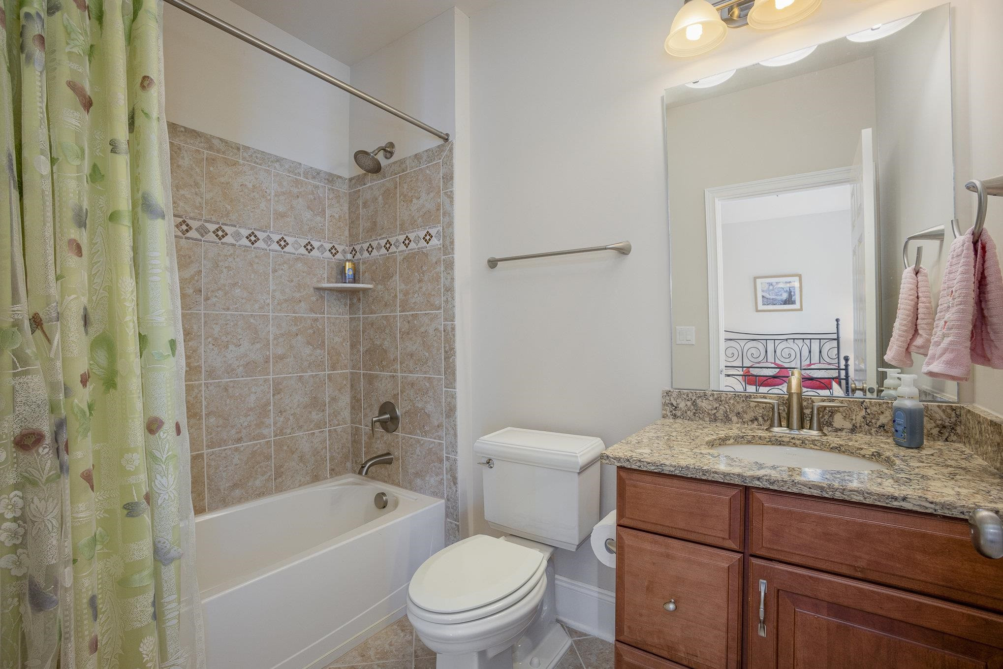 610 Swift Creek Crossing Durham, NC 27713 - Photo 41 of 48 a bathroom with a granite countertop toilet a sink and bathtub