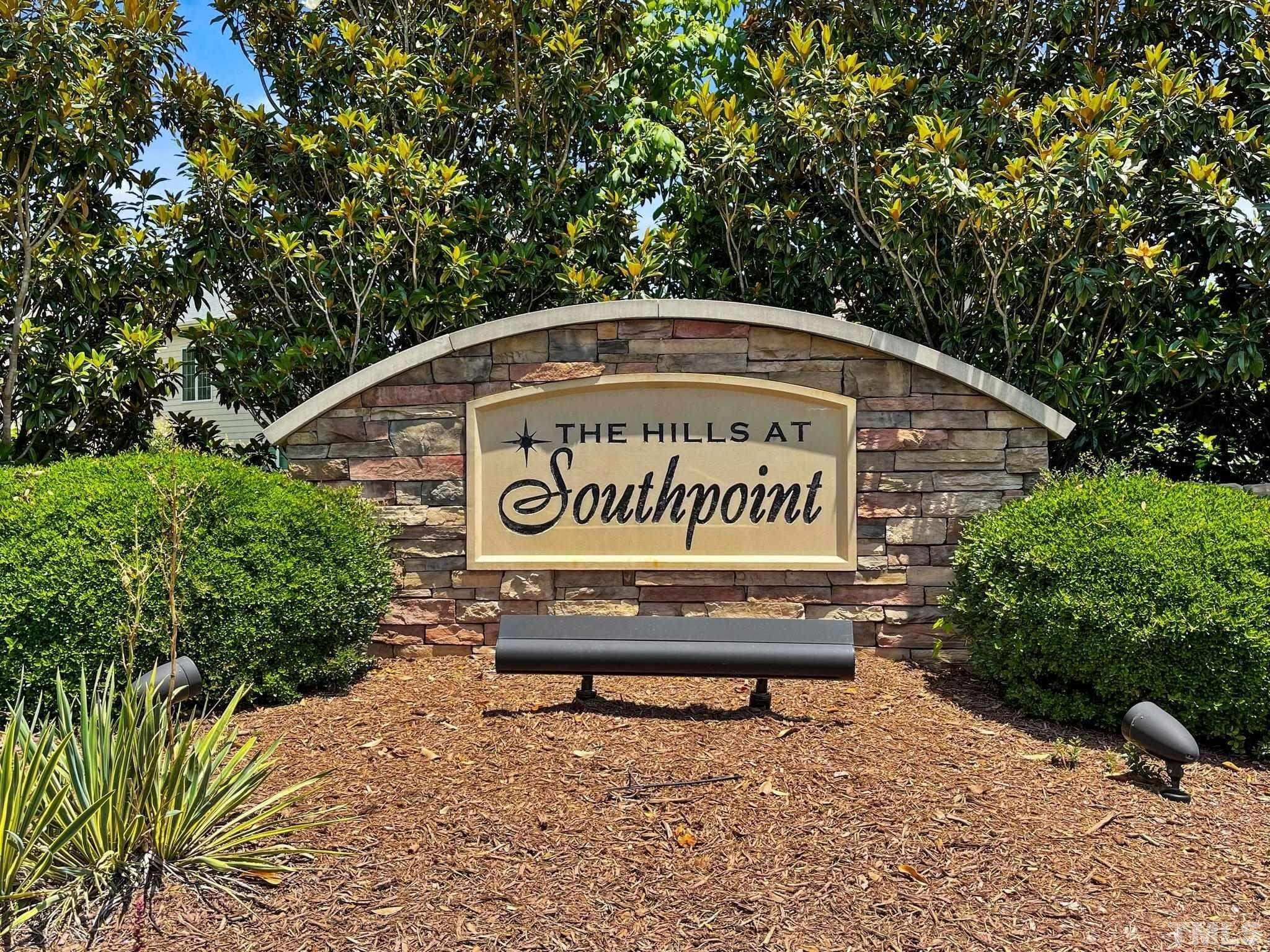 610 Swift Creek Crossing Durham, NC 27713 - Photo 46 of 48 a view of outdoor space with signage and flags